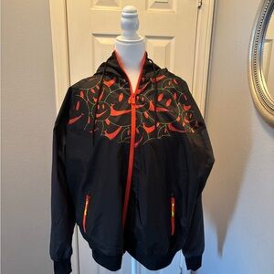 Brandnew Nike windbreaker. Black and orange 🍊 size large.